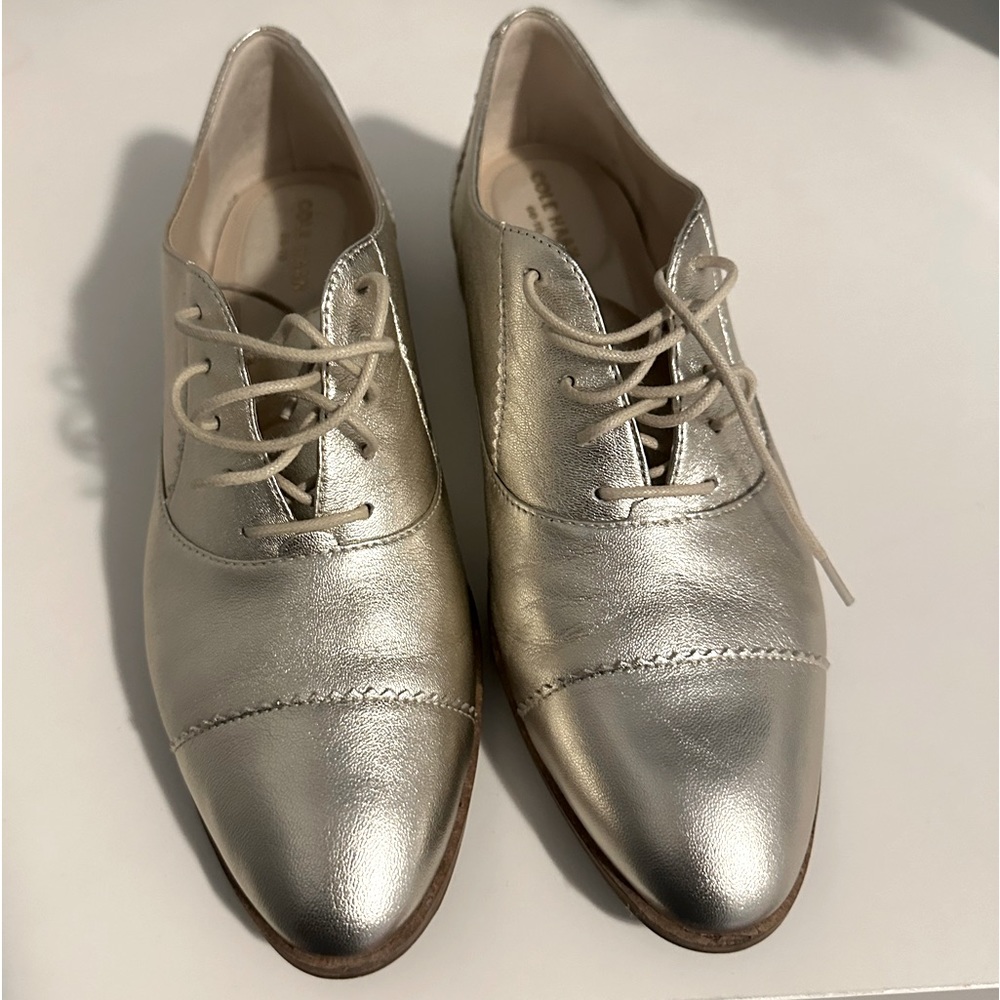 Gold Cole haan oxford shoes.
